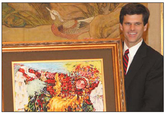 The executive committee of the 2007 Special Olympics World Summer Games presents the embroidery to Timothy Shriver, chairman of the Games.