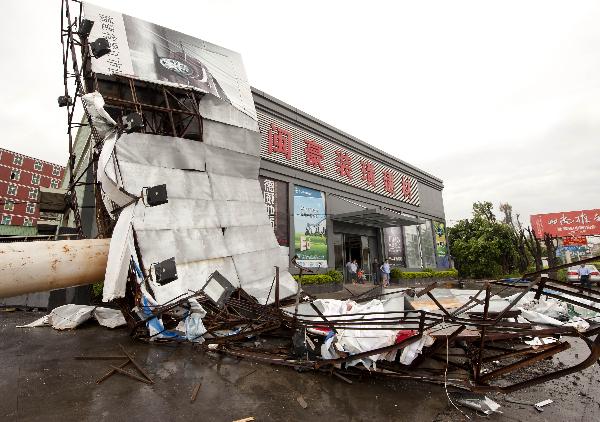 The photo taken on Sept. 10, 2010 shows an advertisement board torn down by the typhoon Meranti in downtown Shishi, southeast China's Fujian Province. Meranti, the 10th typhoon that hit China this year, made landfall at Fujian on Friday, according to provincial flood control authorities. 