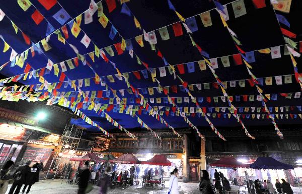 Photo taken on Sept. 11, 2010 shows a street decorated by colorized flags in Shangri-la County, Deqen Tibetan Autonomous Prefecture, southwest China's Yunnan Province. A Kangba art festival will kick off here on Sunday. [Xinhua/Yang Zongyou]