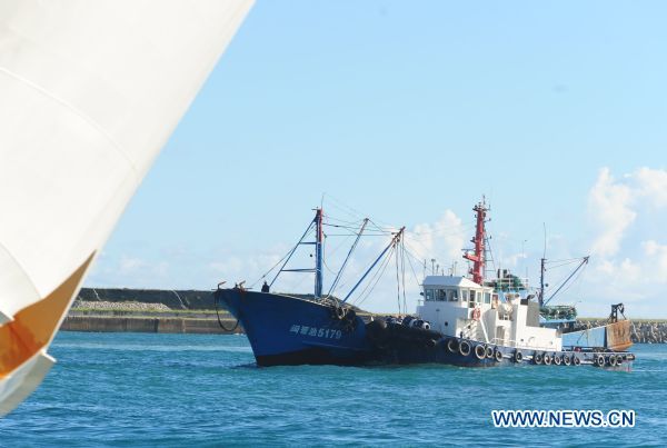The detained Chinese fishing trawler is towed back after an investigation by Japanese authorities near Ishigaki Island in Okinawa Prefecture of Japan Sept. 12, 2010.