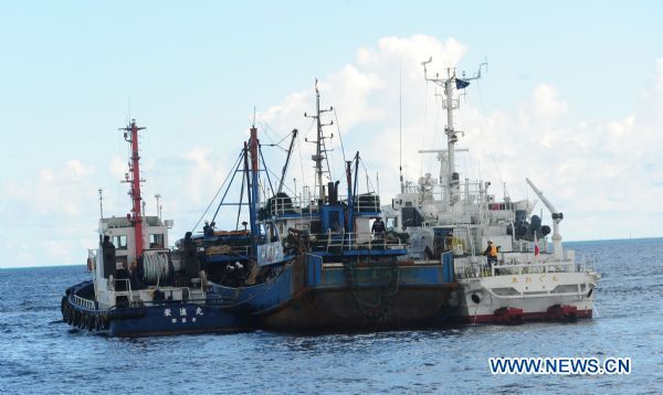 The detained Chinese fishing trawler is flanked by two Japanese Coast Guard vessels during an investigation by Japanese authorities near Ishigaki Island in Okinawa Prefecture of Japan Sept. 12, 2010.