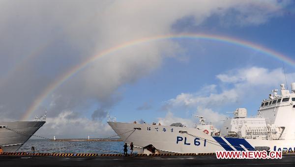 Rainbow is seen near the detained Chinese fishing trawler in Ishigaki Island of Okinawa Prefecture, Japan, Sept. 13, 2010. Fourteen Chinese fishermen detained by the Japanese authorities last week will be released on Monday.