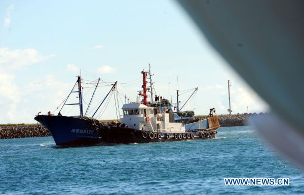 The detained Chinese fishing trawler is towed back after an investigation by Japanese authorities near Ishigaki Island in Okinawa Prefecture of Japan Sept. 12, 2010.