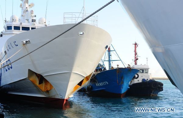 The detained Chinese fishing trawler is towed back after an investigation by Japanese authorities near Ishigaki Island in Okinawa Prefecture of Japan Sept. 12, 2010.