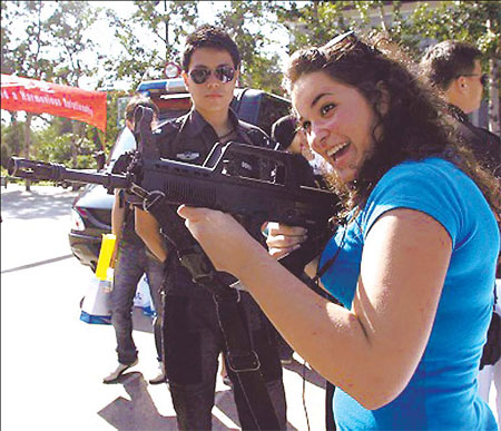 A foreign student gets to grips with an assault rifle at Beijing Language and Culture University.