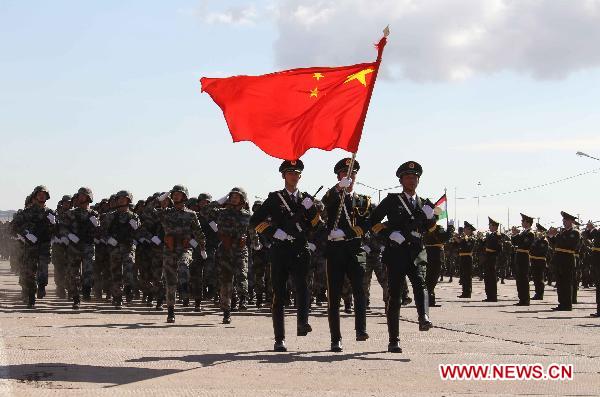 Chinese soldiers participate in the opening ceremony of the second phase of the joint anti-terror drills of the Shanghai Cooperation Organization (SCO), at the Matybulak range near the largest Kazakh city of Almaty on Sept. 13, 2010. The exercises, dubbed &apos;Peace Mission 2010,&apos; entered the second phase on Monday. [Wang Jianmin/Xinhua]