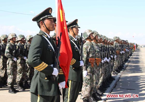 Chinese soldiers participate in the opening ceremony of the second phase of the joint anti-terror drills of the Shanghai Cooperation Organization (SCO), at the Matybulak range near the largest Kazakh city of Almaty on Sept. 13, 2010. The exercises, dubbed &apos;Peace Mission 2010,&apos; entered the second phase on Monday.[Wang Jianmin/Xinhua]