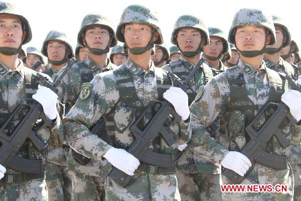 Chinese soldiers participate in the opening ceremony of the second phase of the joint anti-terror drills of the Shanghai Cooperation Organization (SCO), at the Matybulak range near the largest Kazakh city of Almaty on Sept. 13, 2010. The exercises, dubbed &apos;Peace Mission 2010,&apos; entered the second phase on Monday. [Wang Jianmin/Xinhua]