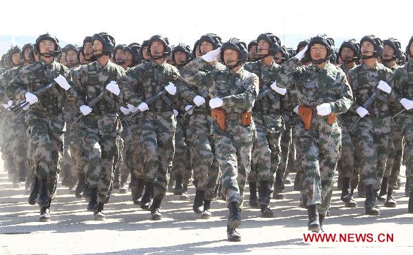 Chinese soldiers participate in the opening ceremony of the second phase of the joint anti-terror drills of the Shanghai Cooperation Organization (SCO), at the Matybulak range near the largest Kazakh city of Almaty on Sept. 13, 2010. The exercises, dubbed &apos;Peace Mission 2010,&apos; entered the second phase on Monday. [Wang Jianmin/Xinhua] 