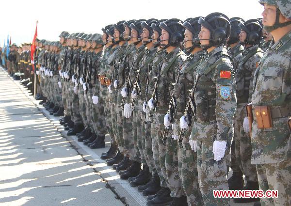 Chinese soldiers participate in the opening ceremony of the second phase of the joint anti-terror drills of the Shanghai Cooperation Organization (SCO), at the Matybulak range near the largest Kazakh city of Almaty on Sept. 13, 2010. The exercises, dubbed &apos;Peace Mission 2010,&apos; entered the second phase on Monday. [Wang Jianmin/Xinhua] 