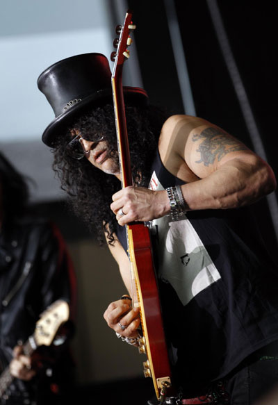 Slash performs during a pre-game concert before the NFL football game