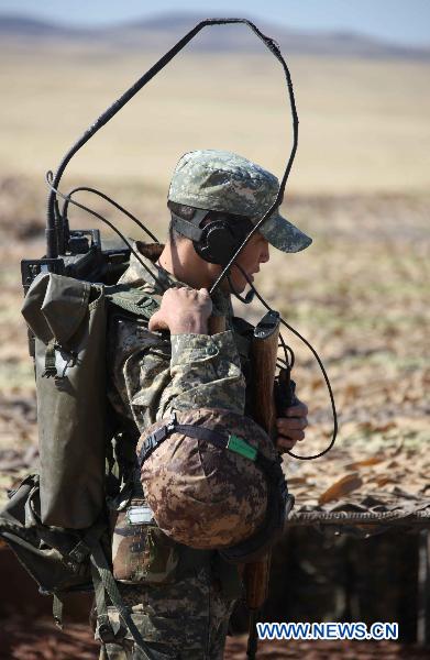 A signalman is seen during the joint military training of troops from five Shanghai Cooperation Organization member states in Matybulak Range in Kazakhstan, Sept. 14, 2010. As part of the &apos;Peace Mission 2010&apos; joint anti-terror drills, soldiers and military officers from Kazakhstan, China, Kyrgyzstan, Russia and Tajikistan conducted the joint military training in Kazakhstan on Tuesday.[Xinhua]