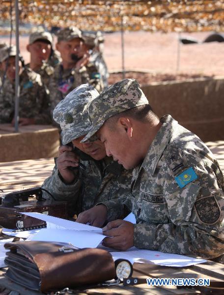 Officers of Kazakhstan conduct training during the joint military training of troops from five Shanghai Cooperation Organization member states in Matybulak Range in Kazakhstan, Sept. 14, 2010. As part of the &apos;Peace Mission 2010&apos; joint anti-terror drills, soldiers and military officers from Kazakhstan, China, Kyrgyzstan, Russia and Tajikistan conducted the joint military training in Kazakhstan on Tuesday.[Xinhua]