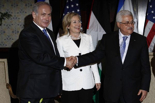 Israeli Prime Minister Benjamin Netanyahu (L) and Palestinian President Mahmoud Abbas (R) shake hands as U.S. Secretary of State Hillary Clinton smiles in the Egyptian resort of Sharm el-Sheikh Sept. 14, 2010. Israeli Prime Minister Benjamin Netanyahu and Palestinian President Mahmoud Abbas started the second round of direct talks on Tuesday in Sharm el-Sheikh after their first round in nearly two years inWashingtonon Sept. 2.[Hayam Adel/Xinhua]