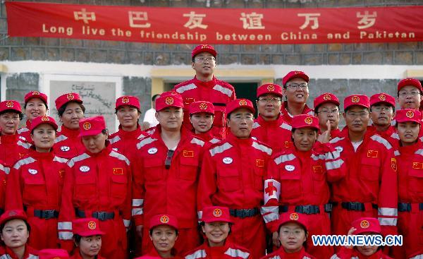 China's second group of aid workers pose for a group photo upon their arrival at Thatta, Pakistan, Sept. 14, 2010. The second Chinese aid team, consisting of 59 members, arrived in Thatta region, which was the worst-hit area in Pakistan's recent nationwide flood, on Tuesday to continue the humanitarian mission.[Zhou Lei/Xinhua]