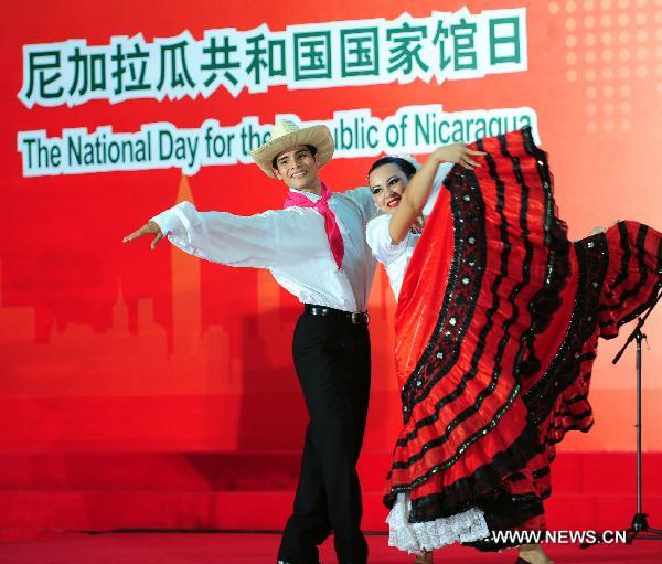 Artists from Nicaragua perform during a ceremony marking the National Pavilion Day of the Republic of Nicaragua in the Shanghai World Expo Park in Shanghai, east China, Sept. 14, 2010.