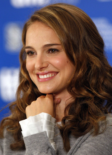 Actress Natalie Portman smiles during a news conference for the film 'Black Swan' at the 35th Toronto International Film Festival September 14, 2010. 