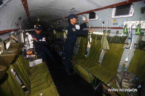 A member of a medical team on a new model of rescue medical helicopter, participates in an exercise in the sea area of Indian Ocean, Sept. 14, 2010. The helicopter made its first debut on Monday after successfully accomplishing the landfall task on the board of hospital ship Peace Ark of the Navy of the Chinese People's Liberation Army. [Xinhua photo]