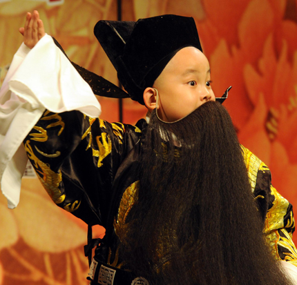 Xie Zifan, a seven-year-old Peking Opera actor, performs during a press conference of 2010 Cross-Strait Mid-Autumn opera show in Taipei, east China's Taiwan, Sept 13, 2010. [Photo/Xinhua]