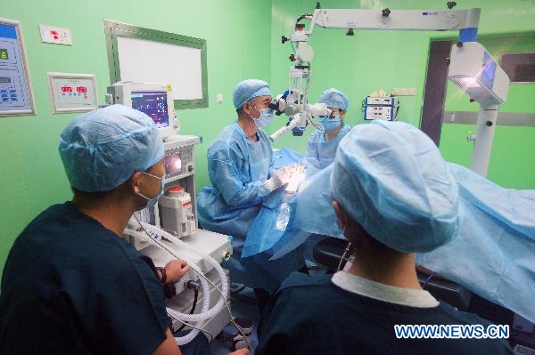 Medical workers treat mock wounded people during an exercise aboard the Chinese navy hospital ship Peace Ark Sept. 15, 2010. The ship on Wednesday arrived in the Gulf of Aden to provide medical service for the Chinese escort fleet, as its first overseas medical mission. [Xinhua] 