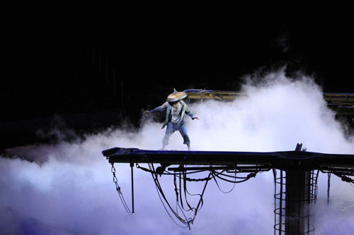 A performer takes part in a preview show of The House of Dancing Water at the City of Dreams resort in Macao September 15, 2010. [China Daily/Agencies]