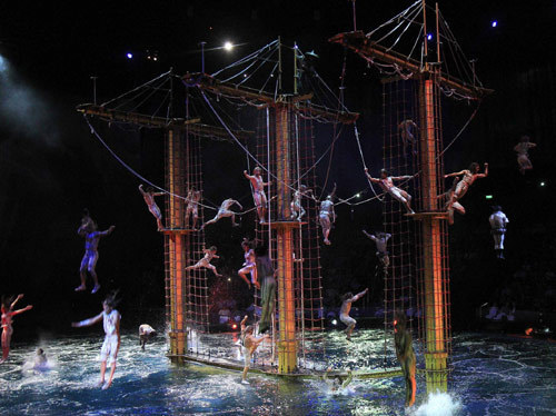 A performer takes part in a preview show of The House of Dancing Water at the City of Dreams resort in Macao September 15, 2010. [China Daily/Agencies]