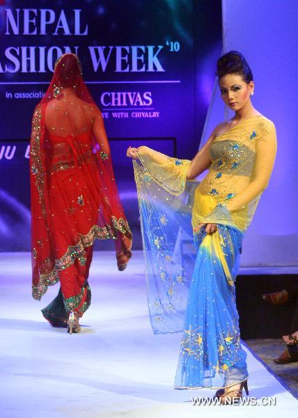 A model presents a creation during the ending of Nepal Fashion Week in Kathmandu, Nepal, Sept. 16, 2010.