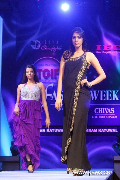 Models present creations during the ending of Nepal Fashion Week in Kathmandu, Nepal, Sept. 16, 2010.