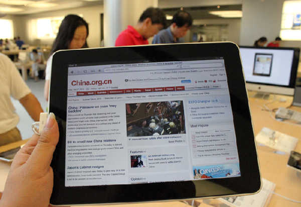 Apple fans flocked to an Apple store in Shanghai early Friday to buy the iPad.