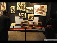 A visitor views file photos at the 9.18 Historical Museum in Shenyang, capital of northeast China's Liaoning Province, Sept. 17, 2010. [Yang Xinyue/Xinhua] 