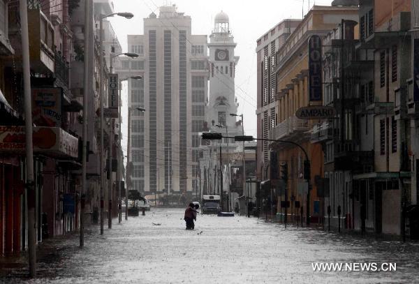 A street is flooded in Veracruz, Mexico, Sept. 17, 2010. Hurricane Karl on Friday struck Mexico&apos;s east coast, killing two people and forcing the country to shut down the Laguna Verde nuclear power station, a local radio reported. [Jorge Dan/Xinhua]