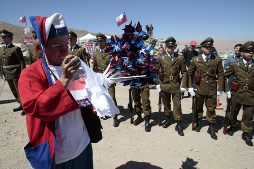 Rescue drill reaches trapped Chilean miners amid celebrations
