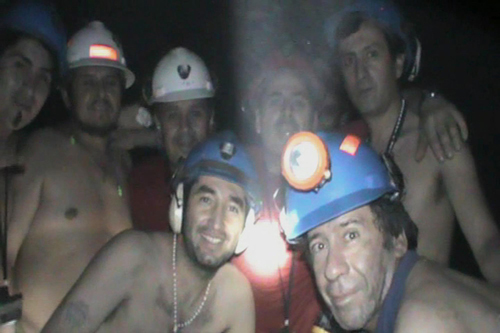 Rescue drill reaches trapped Chilean miners amid celebrations