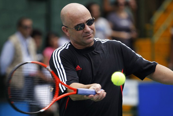 Andre Agassi of the U.S. plays tennis at a meeting with children during part of his farewell tour in Heredia, near San Jose September 18, 2010. The 40-year-old American, who retired in 2006, headlined a list of nominees for the International Tennis Hall of Fame following a sparkling career highlighted by eight grand slam titles and an Olympic gold medal. (Xinhua/Reuters Photo)