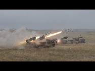 Rockets are fired at an exercise of 'Peace Mission 2010' joint anti-terror drills conducted by five Shanghai Cooperation Organization (SCO) member states in Matybulak Range of Kazakhstan, Sept. 18, 2010. Troops from five SCO countries launched the first live firing drill Friday in the southern Kazakh training ground. [Sohu]
