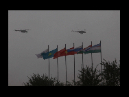 Military helicopters are seen at an exercise of 'Peace Mission 2010' joint anti-terror drills conducted by five Shanghai Cooperation Organization (SCO) member states in Matybulak Range of Kazakhstan, Sept. 18, 2010. Troops from five SCO countries launched the first live firing drill Friday in the southern Kazakh training ground. [Sohu]