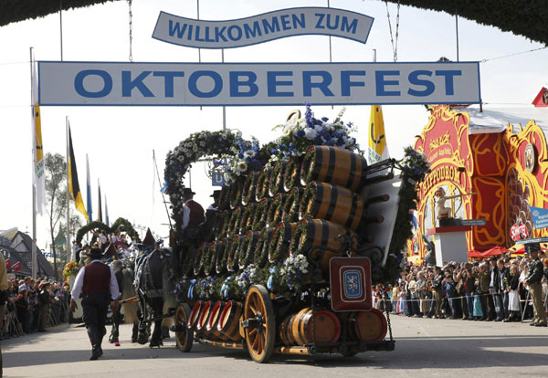 A cart with beer barrels takes part in the Parade of the Landlords and Breweries during the opening of the 177th Oktoberfest in Munich Sept 18, 2010. Millions of beer drinkers from around the world will come to the Bavarian capital over the next two weeks for the world&apos;s biggest and most famous beer festival, the Oktoberfest, which celebrates its 200th anniversary this year.[China Daily/Agencies]