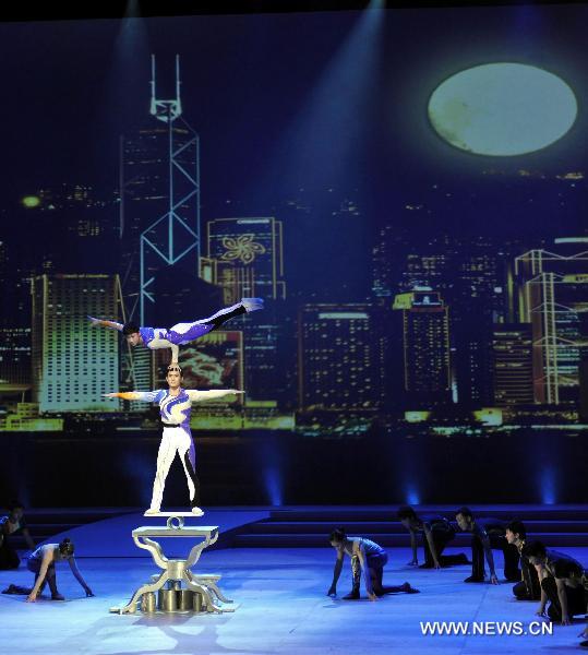 Acrobats perform at an evening gala celebrating the upcoming mid-autumn day in Hong Kong, south China, Sept. 19, 2010.