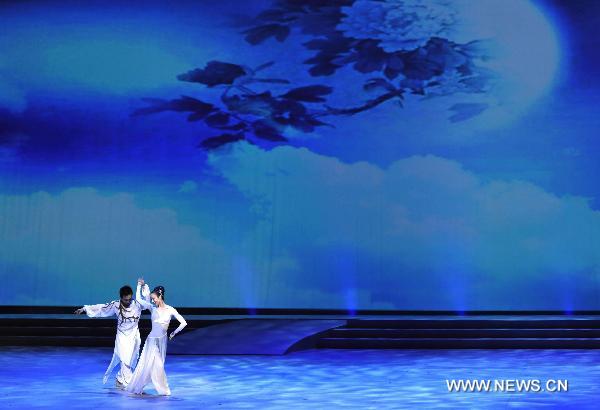 Dancers perform at an evening gala celebrating the upcoming mid-autumn day in Hong Kong, south China, Sept. 19, 2010.