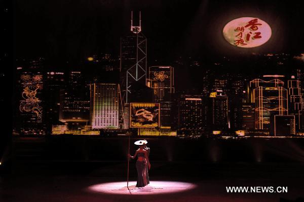 Dancers perform at an evening gala celebrating the upcoming mid-autumn day in Hong Kong, south China, Sept. 19, 2010.