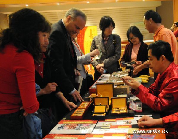 Visitors view handicrafts from north China's Hebei Province during the opening ceremony of the Hebei Culture Week at the Vancouver Chinese Cultural Festival in Vancover, Canada, Sept. 17, 2010.
