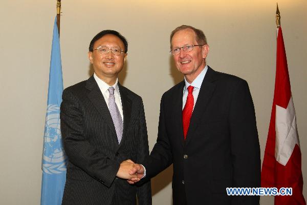 Chinese Foreign Minister Yang Jiechi (L) meets with Joseph Deiss, president of the 65th session of the UN General Assembly (GA), at the UN headquarters in New York, the United States, Sept. 20, 2010. [Liu Xin/Xinhua]