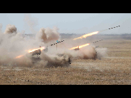 Over 100 pieces of artillery fired shots with extremely loud sound, and a hail of shells were dropped onto the battlefield of the 'enemies,' completely destroying targets.  [Xinhua]