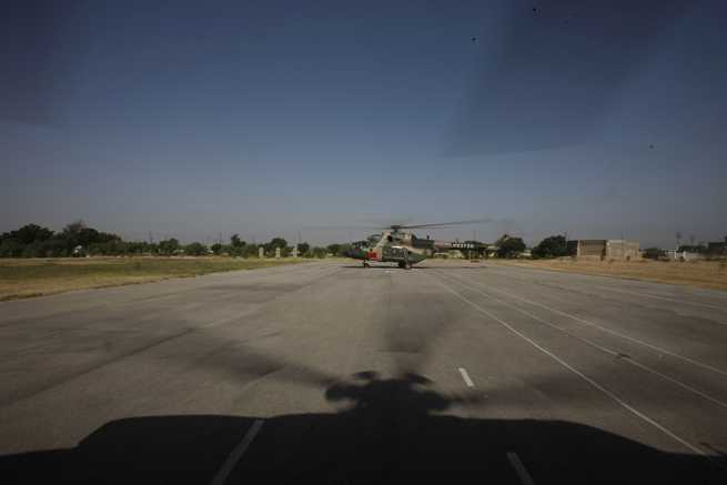 Helicopters of the Chinese helicopter rescue team return after a mission at a flooded area 160 km away from Hyderabad, Pakistan, Sept. 25, 2010. The Chinese helicopter rescue team accomplished its first mission in flooded areas in Pakistan on Saturday. [Xinhua]