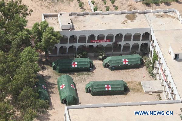 Aerial image taken on a helicopter of the Chinese helicopter rescue team during their first mission shows the camp of China&apos;s People&apos;s Liberation Army(PLA) medical rescue team in Sehwan, Pakistan, Sept. 25, 2010. The Chinese helicopter rescue team accomplished its first mission in flooded areas in Pakistan on Saturday. [Li Xiang/Xinhua]