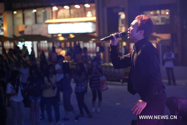 A singer performs during the World Revolution Music Festival in Macao, south China, Sept. 25, 2010. The musical events aimed to promote an anti-drugs society.