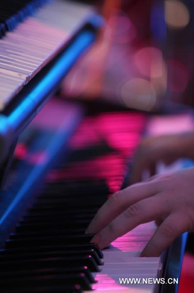 A musician plays during the World Revolution Music Festival in Macao, south China, Sept. 25, 2010. The musical events aimed to promote an anti-drugs society.