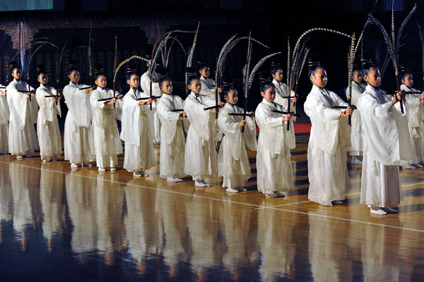 Students in Hanfu, or traditional Chinese costumes perform, at the celebration on Sunday in Taipei. [Xinhua] 