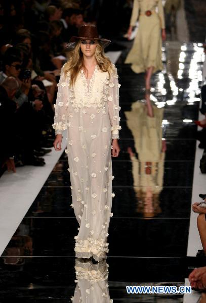 A model displays a creation as part of Just Cavalli spring-summer 2011 ready-to-wear collection during the Women's fashion week in Milan, Italy, Sept. 25, 2010.