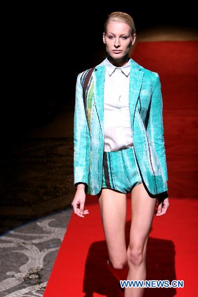 A model displays a creation as part of ROBERTO MUSSO spring-summer 2011 ready-to-wear collection during the Women's fashion week in Milan, Italy, Sept. 25, 2010.